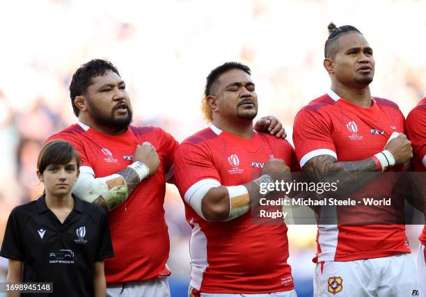 Ben Tameifuna, Siegfried Fisi'ihoi and Vaea Fifita of Tonga line up during the National Anthems prior to the Rugby World Cup France 2023 match...