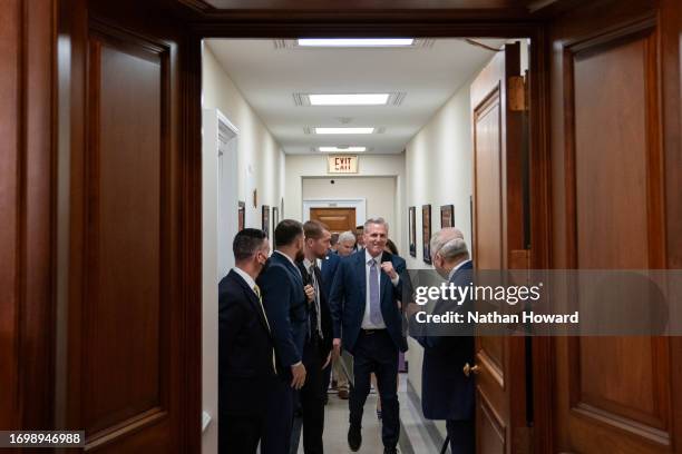 House Speaker Kevin McCarthy celebrates with Majority Leader Steve Scalise following passage in the House of a 45 day continuing resolution on...