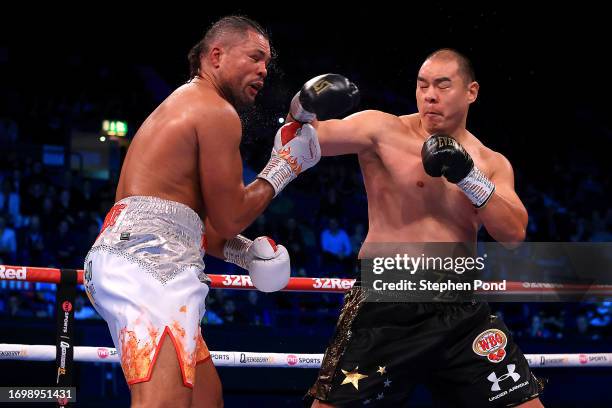 Zhilei Zhang punches Joe Joyce during the WBO Interim World Heavyweight Title fight between Zhilei Zhang and Joe Joyce at OVO Arena Wembley on...