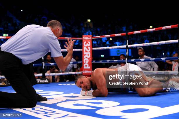 Joe Joyce lies on the floor following a punch from Zhilei Zhang during the WBO Interim World Heavyweight Title fight between Zhilei Zhang and Joe...