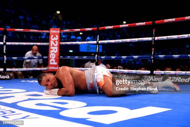 Joe Joyce lies on the floor following a punch from Zhilei Zhang during the WBO Interim World Heavyweight Title fight between Zhilei Zhang and Joe...