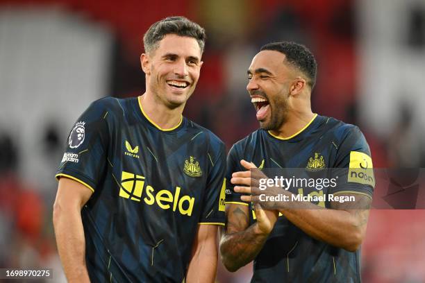 Fabian Schar and Callum Wilson of Newcastle United celebrate after the team's victory during the Premier League match between Sheffield United and...