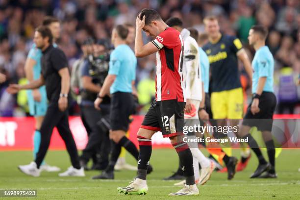 John Egan of Sheffield United looks dejected following the team's defeat during the Premier League match between Sheffield United and Newcastle...