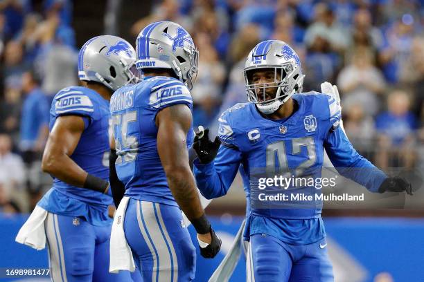 Jalen Reeves-Maybin of the Detroit Lions and Derrick Barnes of the Detroit Lions react in the first quarter of a game against the Atlanta Falcons at...