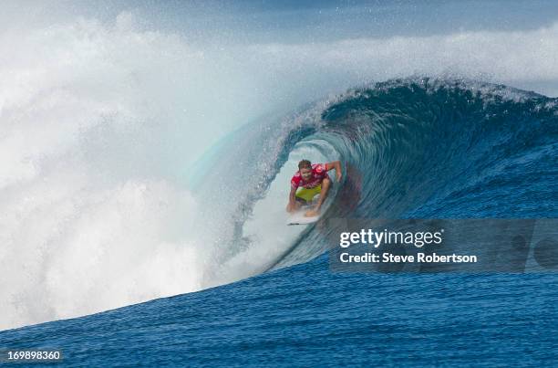 Taj Burrow of Australia in the barrel at the Volcom Pro Fiji during round one on June 4, 2013 in Tavarua, Fiji.