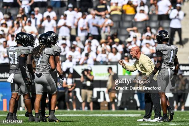 Defensive coordinator Charles Kelly of the Colorado Buffaloes asks his defense for a stop in the fourth quarter against the USC Trojans at Folsom...