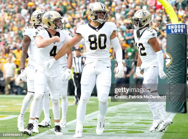 Derek Carr of the New Orleans Saints celebrates with Jimmy Graham of the New Orleans Saints after Graham's receiving touchdown during the first...