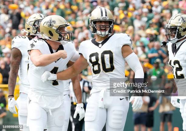 Derek Carr of the New Orleans Saints celebrates with Jimmy Graham of the New Orleans Saints after Graham's receiving touchdown during the first...