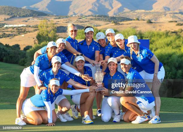 Suzann Pettersen of Norway the Captain of The European Team celebrate with The Solheim Cup after the final day singles matches on Day Three of the...