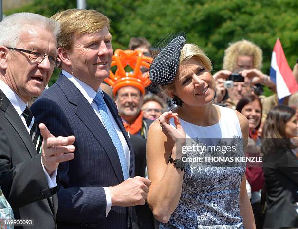 Queen Maxima and King Willem-Alexander of the Netherlands and Baden-Wuerttemberg's state governor Winfried Kretschmann greet the spectators in front...