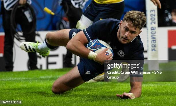 Scotland's Ollie Smith scores a try during a Rugby World Cup match between Scotland and Romania at the Stade Pierre Mauroy, on September 30 in Lille,...