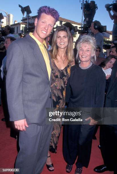 Actor Jake Busey, girlfriend and his mother Judy Busey attend the "Contact" Westwood Premiere on July 1, 1997 at the Mann Village Theatre in...