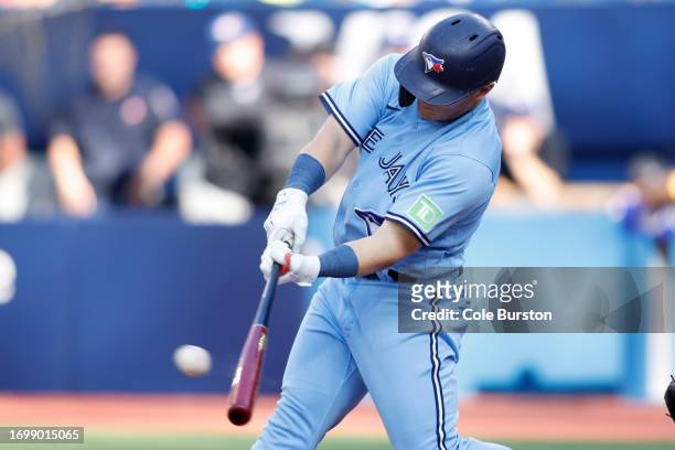 Daulton Varsho of the Toronto Blue Jays hits a two-RBI single in the fourth inning of their MLB game against the Tampa Bay Rays at Rogers Centre on...
