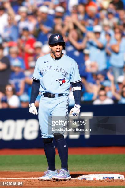 George Springer of the Toronto Blue Jays celebrates on base as he hits an RBI single in the fourth inning of their MLB game against the Tampa Bay...