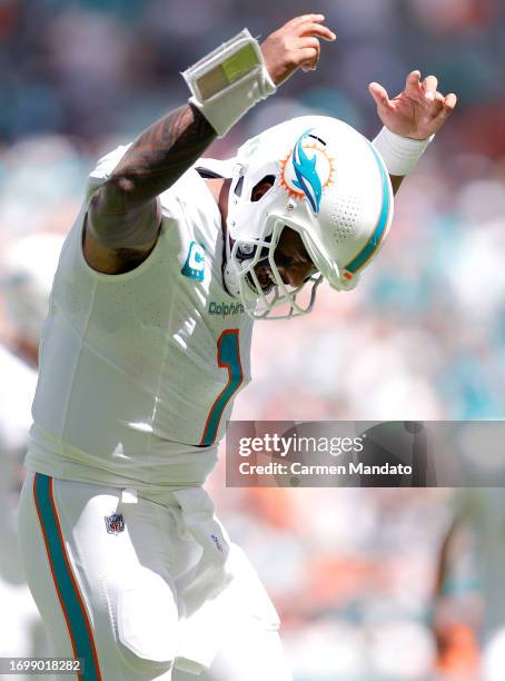 Tua Tagovailoa of the Miami Dolphins celebrates after his touchdown pass during the second quarter against the Denver Broncos at Hard Rock Stadium on...