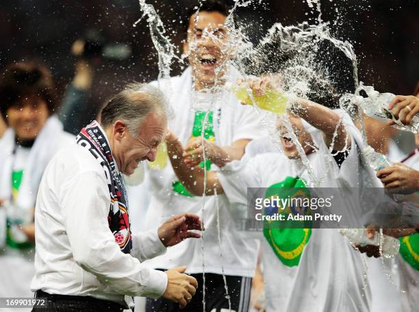 Alberto Zaccheroni Head Coach of Japan is soaked by players after the FIFA World Cup qualifier match between Japan and Australia at Saitama Stadium...