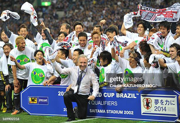 Japan coach Alberto Zaccheroni and players celebrate after a football match against Australia in the Asian final qualyfying round for the 2014 World...