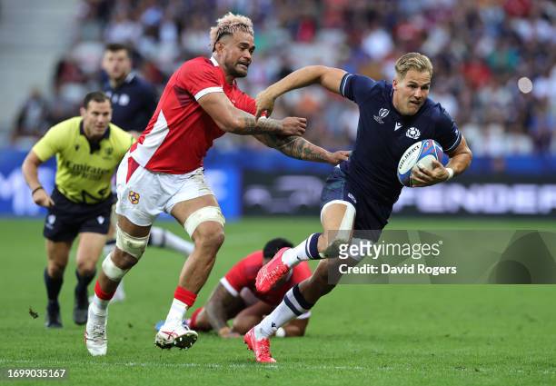 Duhan van der Merwe of Scotland moves away from Vaea Fifita during the Rugby World Cup France 2023 group B match between Scotland and Tonga at Stade...