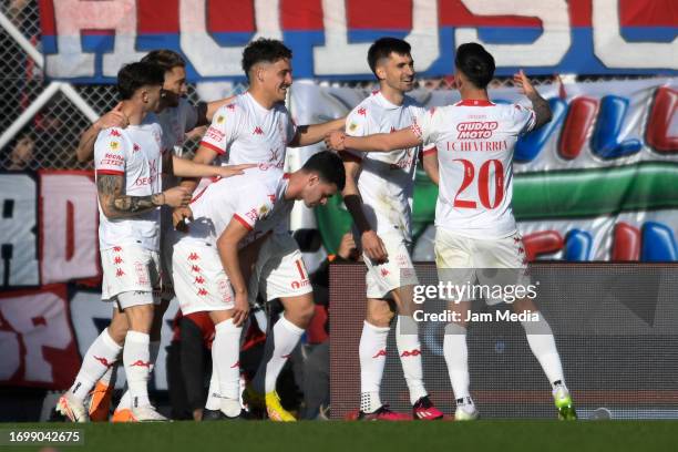 Ignacio Pussetto of Huracan celebrates scoring his team's first goal with teammates during a match between San Lorenzo and Huracan as part of Copa de...