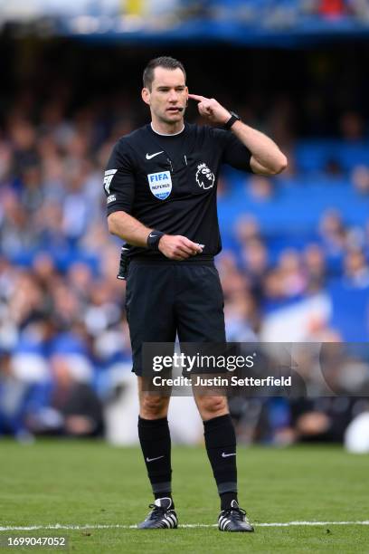 Referee Jarred Gillet reacts during the Premier League match between Chelsea FC and Aston Villa at Stamford Bridge on September 24, 2023 in London,...