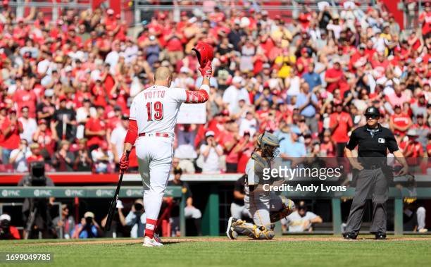 Joey Votto of the Cincinnati Reds acknowledges the crowd before his first at bat against the Pittsburgh Pirates at Great American Ball Park on...