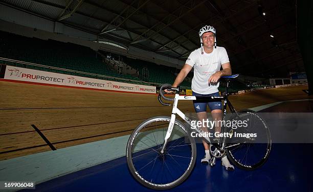 Laureus Academy Ambassador Michael Vaughan poses for a photograph during the PruProtect Chance to Ride Launch at the National Cycling Centre on June...