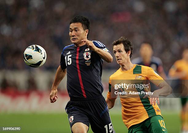 Yasuyuki Konno of Japan in action during the FIFA World Cup qualifier match between Japan and Australia at Saitama Stadium on June 4, 2013 in...