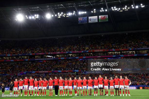 The players of Wales line up during the National Anthems prior to the Rugby World Cup France 2023 match between Wales and Australia at Parc Olympique...
