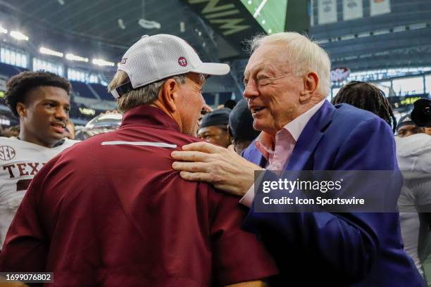 Texas A&M Aggies head coach Jimbo Fisher talks with Dallas Cowboys owner and GM Jerry Jones after the game between the Arkansas Razorbacks and the...