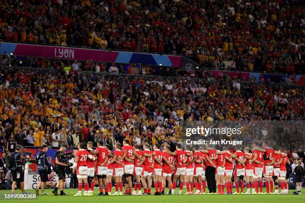 The players of Wales line up during the National Anthems prior to the Rugby World Cup France 2023 match between Wales and Australia at Parc Olympique...