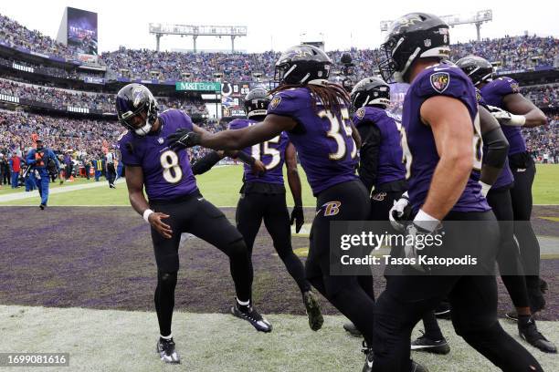 Lamar Jackson of the Baltimore Ravens celebrates a touchdown with teammates in first half of a game against the Indianapolis Colts at M&T Bank...