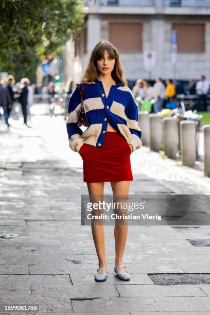 MILAN - JANUARY 13: Woman with Louis Vuitton bag and blue and orange sweater  before Emporio Armani fashion show, Milan Fashion Week street style on Ja  Stock Photo - Alamy