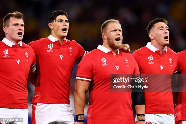 Nick Tompkins, Louis Rees-Zammit, Corey Domachowski and Josh Adams of Wales sing their national anthem prior to the Rugby World Cup France 2023 match...