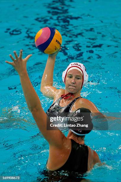 Kelly Rulon of the United States challenges Monika Eggens of Canada during day fourth of the FINA Women's World League Super Final 2013 match between...
