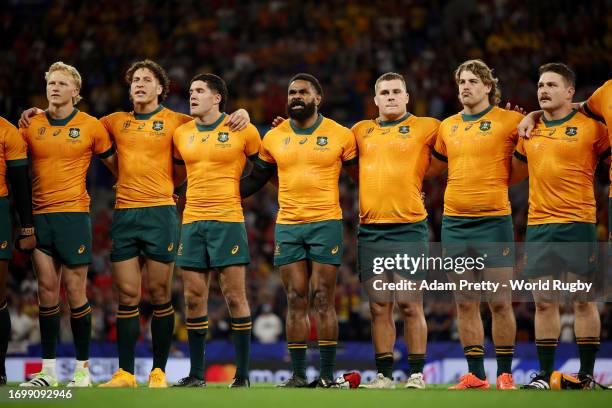 Players of Australia line up during the National Anthems prior to the Rugby World Cup France 2023 match between Wales and Australia at Parc Olympique...