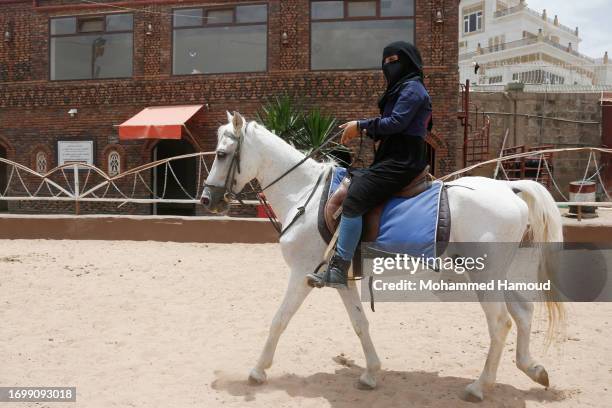 Yemeni girl learns to ride a horse at an equestrian club on August 03, 2023 in Sana'a, Yemen. Nine years of war and a humanitarian crisis in Yemen’s...