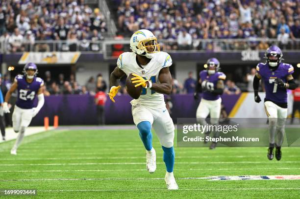 Mike Williams of the Los Angeles Chargers runs for touchdown after a catch during the third quarter against the Minnesota Vikings at U.S. Bank...