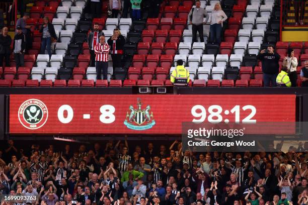 General view of the scoreboard showing 0 - 8 as Newcastle United fans celebrate following the Premier League match between Sheffield United and...