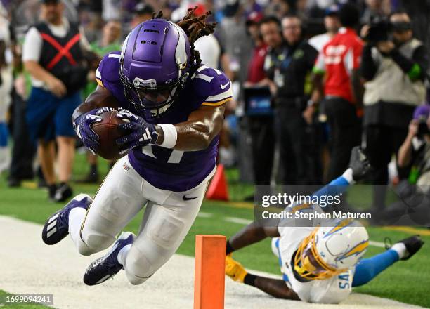 Asante Samuel Jr. #26 of the Los Angeles Chargers watches as K.J. Osborn of the Minnesota Vikings dives into the end zone for a touchdown during the...