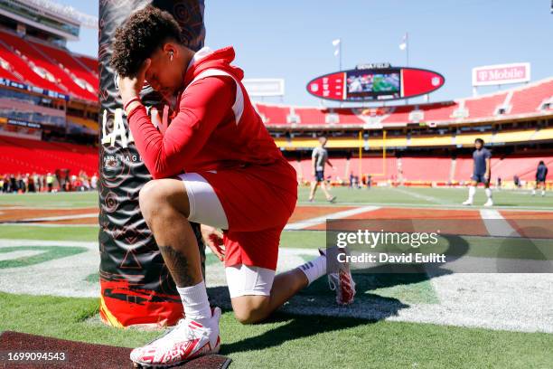 Patrick Mahomes of the Kansas City Chiefs prays prior to a game against the Chicago Bears at GEHA Field at Arrowhead Stadium on September 24, 2023 in...