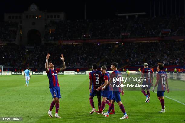 Joao Cancelo of FC Barcelona celebrates with his teammates after scoring the team's third goal during the LaLiga EA Sports match between FC Barcelona...