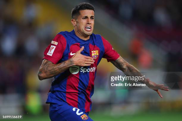 Joao Cancelo of FC Barcelona celebrates after scoring the team's third goal during the LaLiga EA Sports match between FC Barcelona and Celta Vigo at...