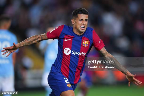 Joao Cancelo of FC Barcelona celebrates after scoring the team's third goal during the LaLiga EA Sports match between FC Barcelona and Celta Vigo at...