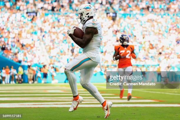 Raheem Mostert of the Miami Dolphins rushes for a touchdown during the third quarter against the Denver Broncos at Hard Rock Stadium on September 24,...