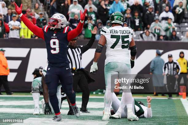 Matthew Judon of the New England Patriots celebrates after sacking Zach Wilson of the New York Jets for a safety in the fourth quarter at MetLife...