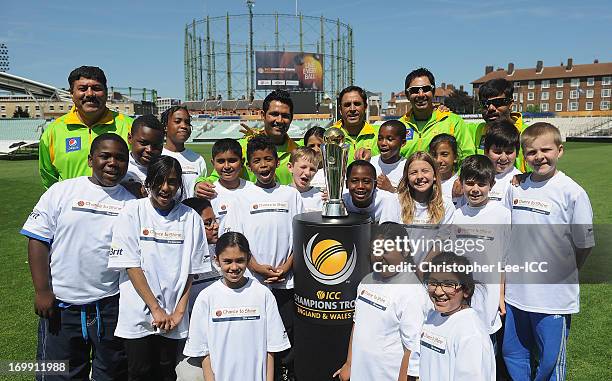 Asad Shafiq , Abdur Rehman , Nasir Jamshed with other members of the Pakistan Team pose for a photograph with children from the Curwen Primary School...
