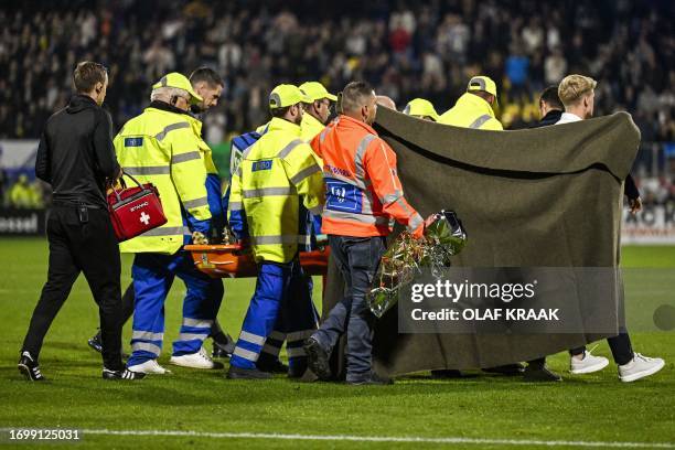 Waalwijk's Dutch goalkeeper Etienne Vaessen is carried on a stretcher after he collapsed during the Dutch Eredivisie match between RKC Waalwijk and...