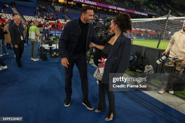 Adil Rami and Léna Mahfouf are seen during the Ligue 1 Uber Eats match between Paris Saint-Germain and Olympique de Marseille at Parc des Princes on...