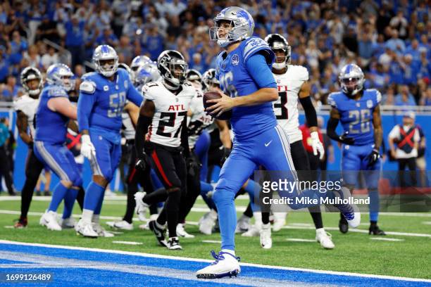 Jared Goff of the Detroit Lions scores a touchdown in the fourth quarter of a game against the Atlanta Falcons at Ford Field on September 24, 2023 in...