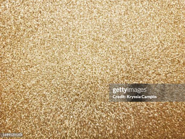 glitter texture in golden color - sparkle stock pictures, royalty-free photos & images